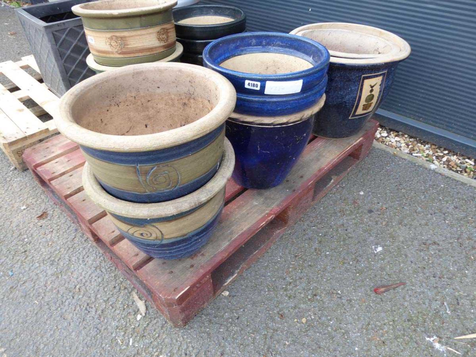 7 blue painted garden pots