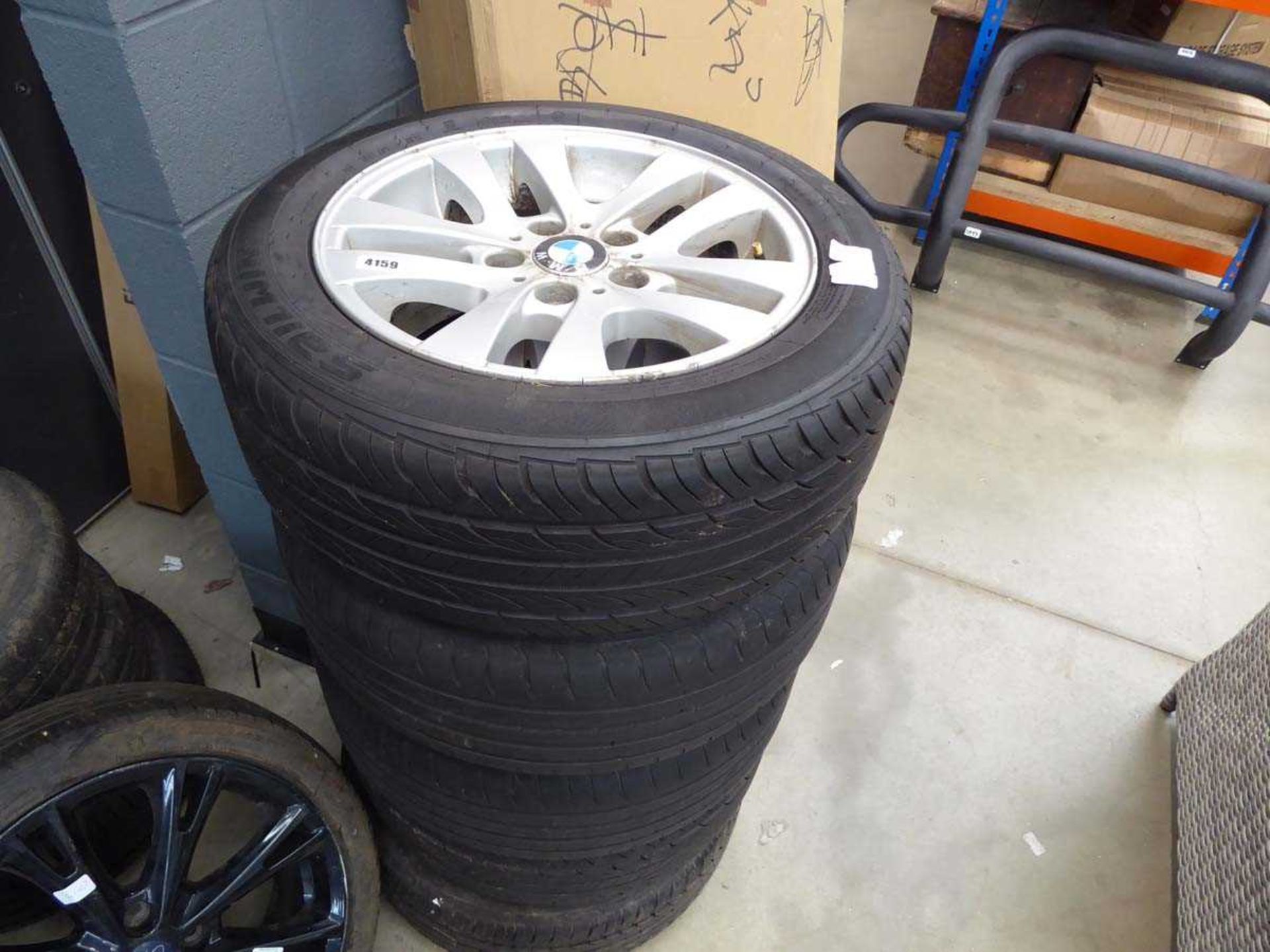 3 BMW alloy wheels and tyres, 1 Toyota alloy wheel and tyre and a tyre, no wheel