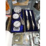 2 silver and silver plated pocket watches, a sifting spoon and 2 butter knives