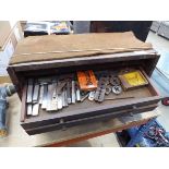 Wooden engineer's toolbox with small quantity of tools