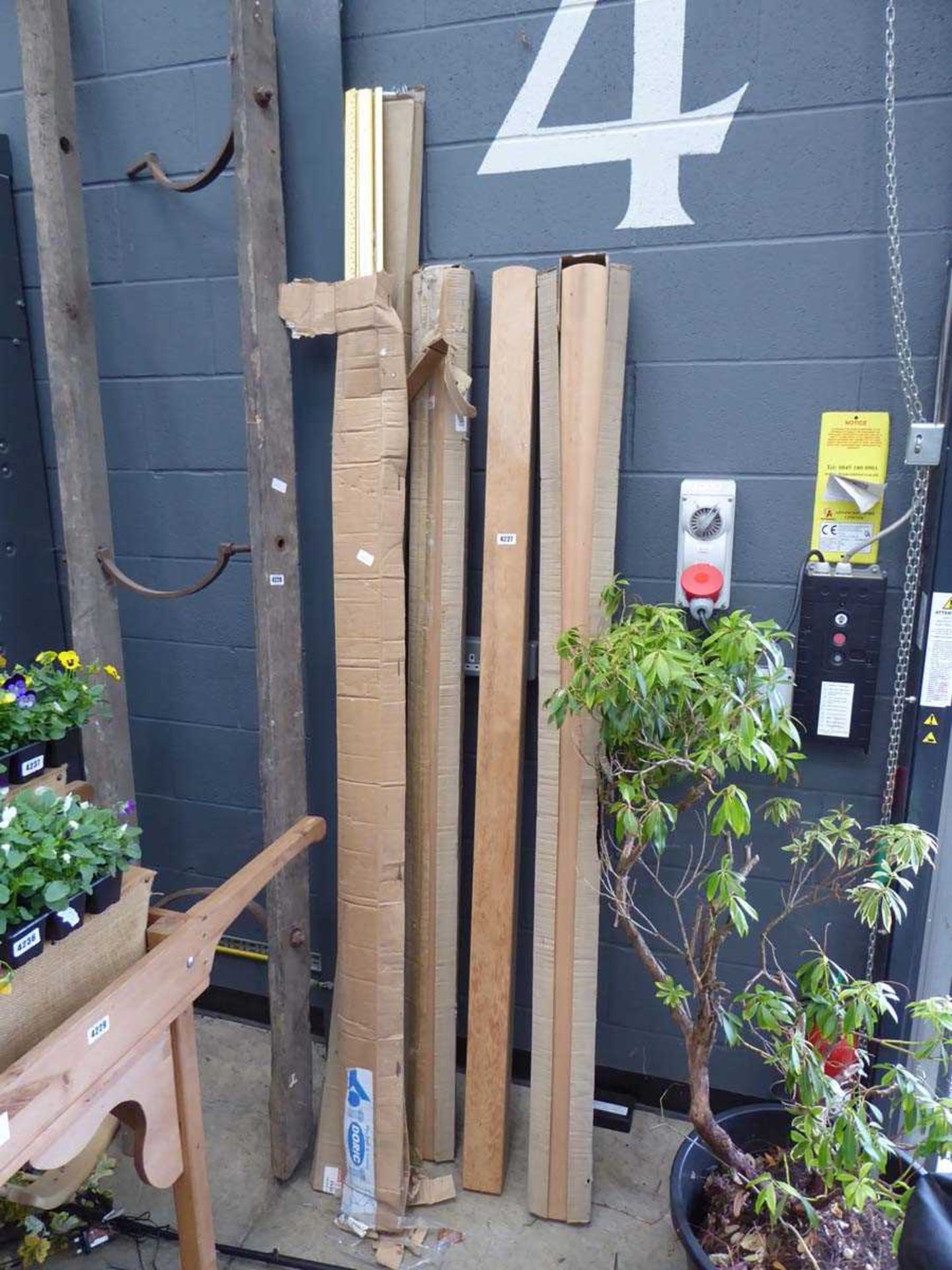 3 wooden posts and quantity of edging trim