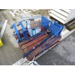 5 small blue metal trolleys and a wheeled roller