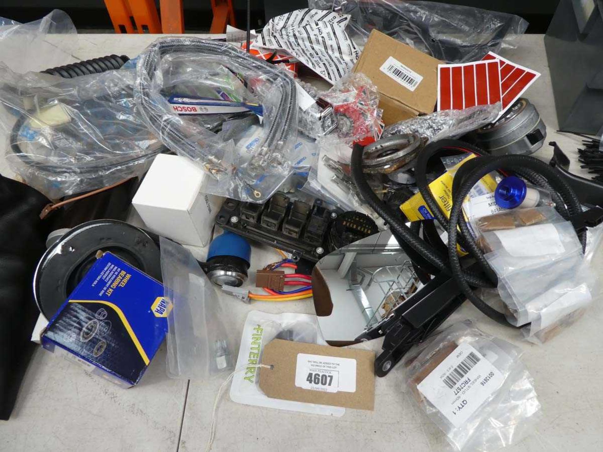 +VAT Bag of car parts and accessories including wheel bearing kit, hoses, filters, switches,