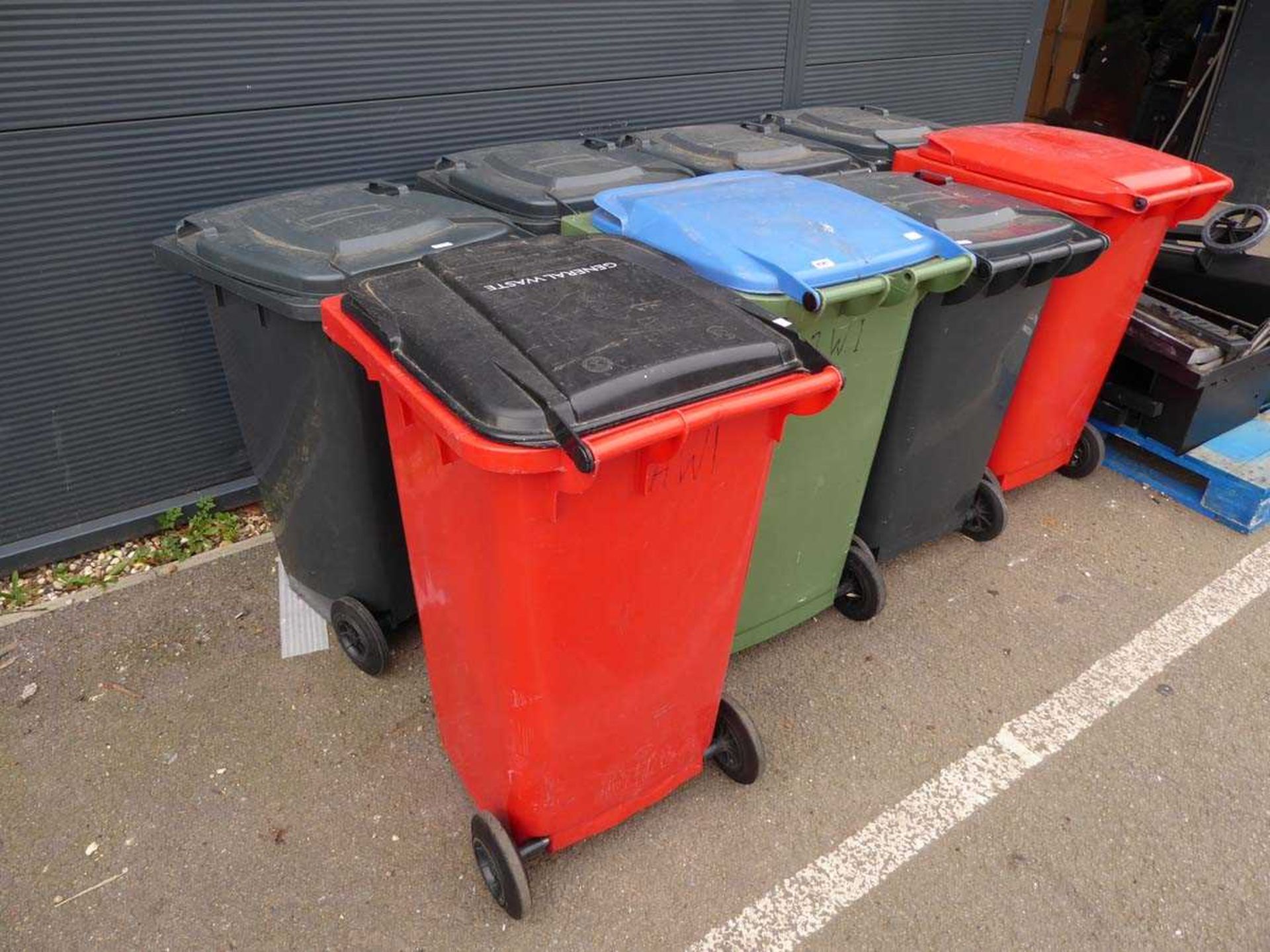 Eight assorted rubbish bins