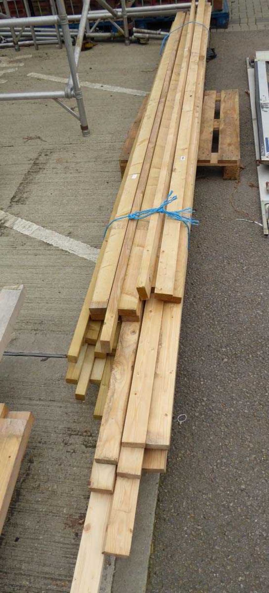 Pallet of long lengths of timber