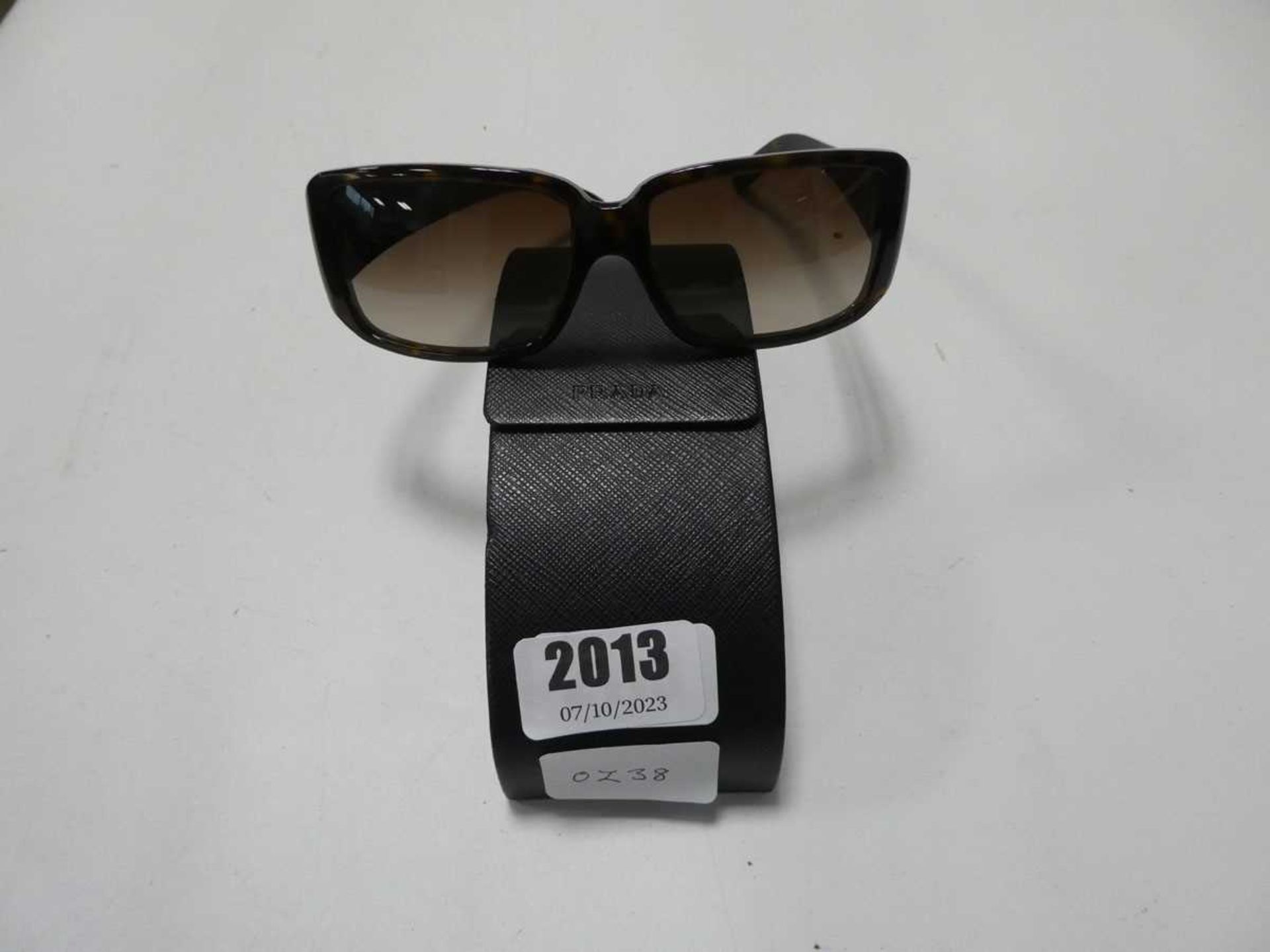 Pair of Prada sunglasses in case