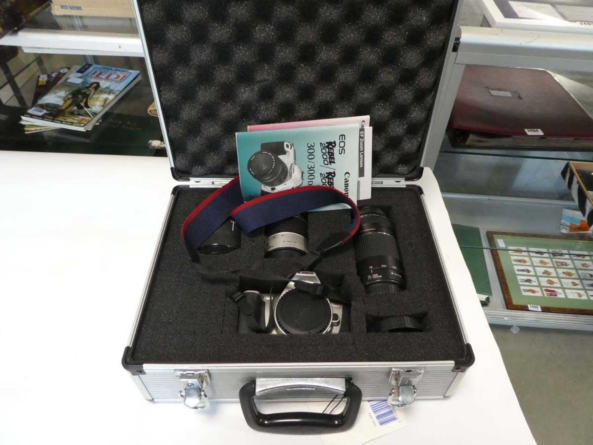 Case containing Canon EOS300 camera with lenses