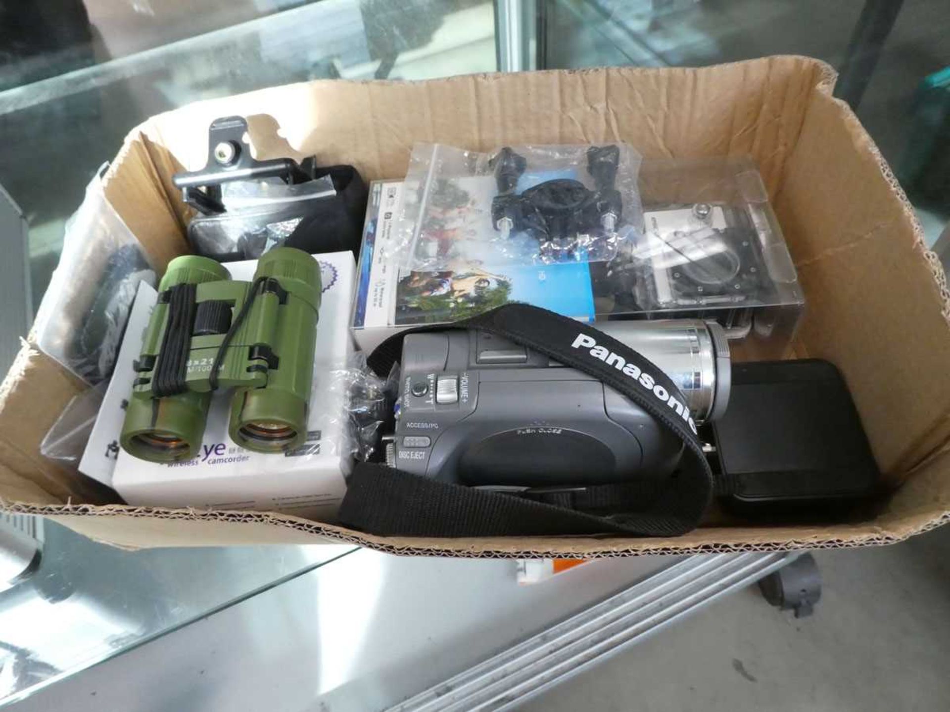 Tray containing Panasonic camcorder, binoculars etc