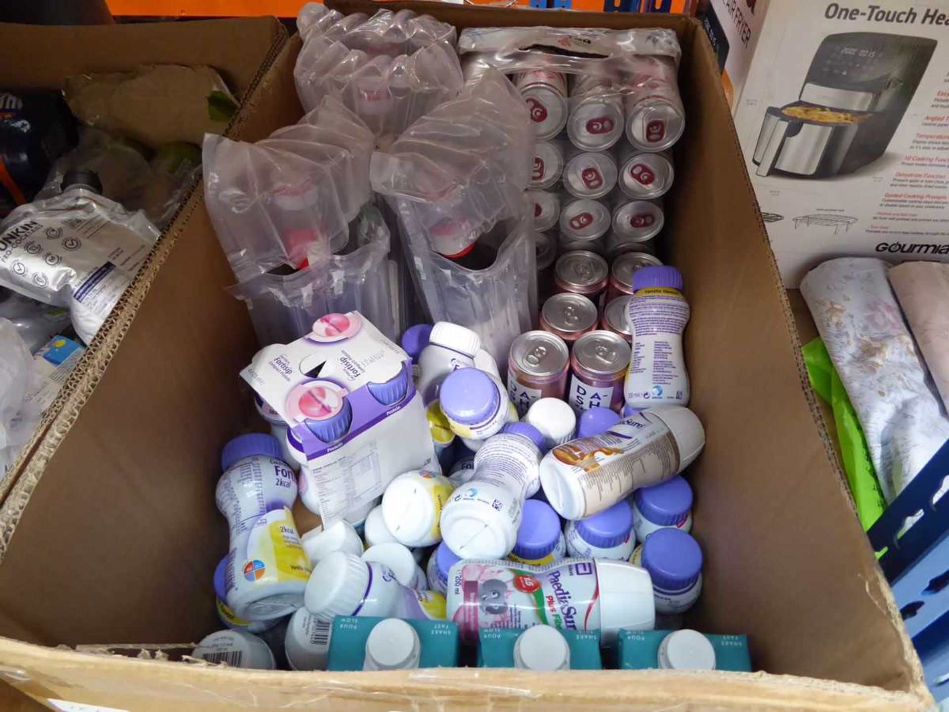 Large box of infant milk, canned drinks and coffee syrup