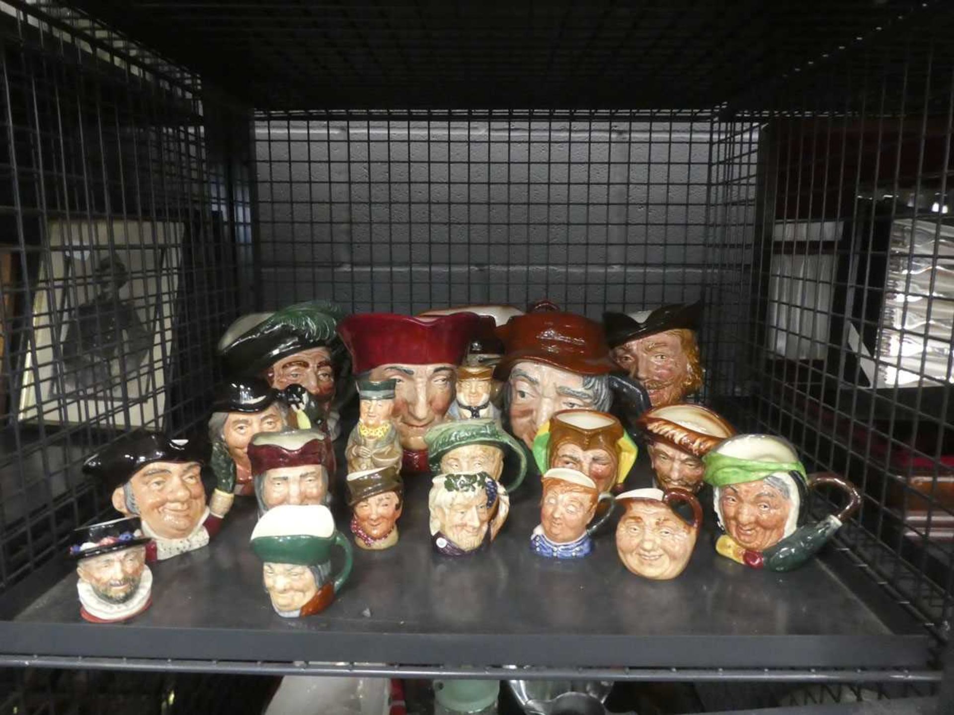 Cage containing character and Toby jugs