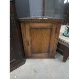 Small oak single door corner cupboard