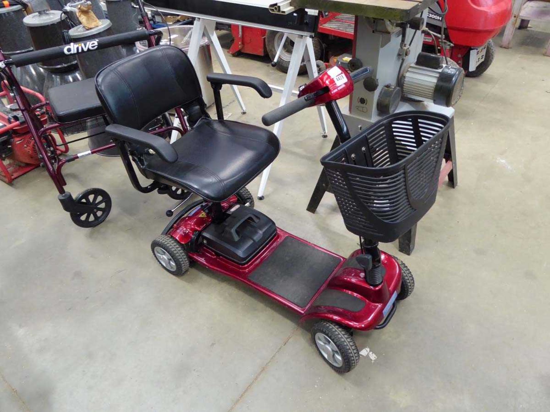 Red 4-wheel mobility scooter