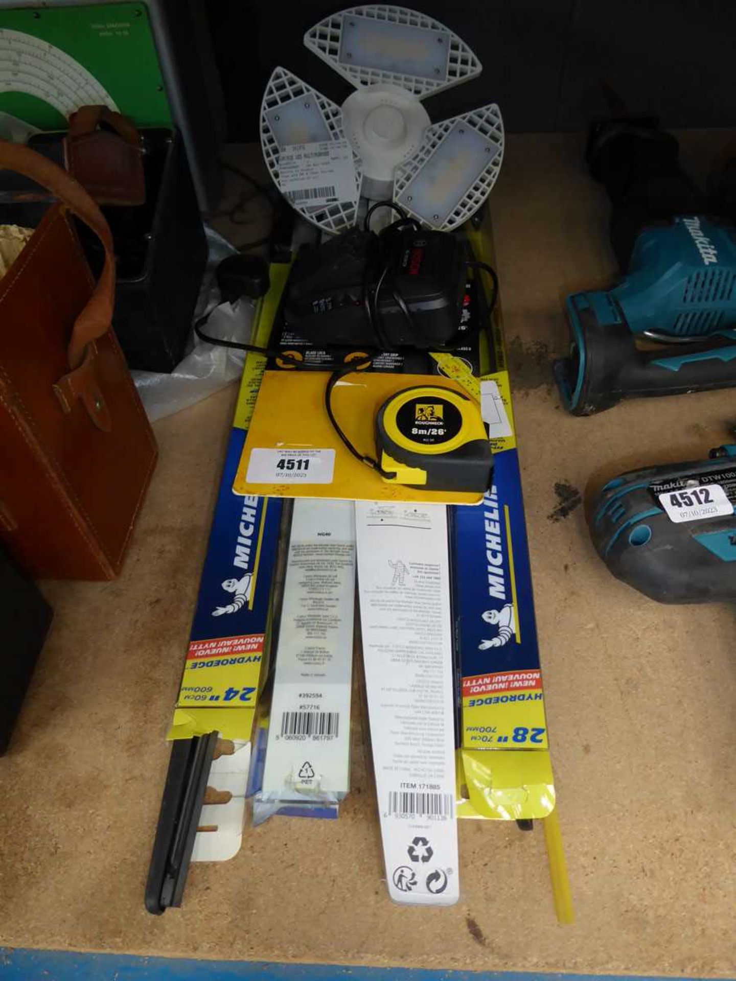 +VAT Various windscreen wipers, Bosch battery charger and a measuring tape, and light - Image 2 of 2