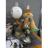 Two brass oil lamps with glass shades and reservoirs. Plus modern 3 branch lily shaped table lamp