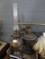 Three brass lamps