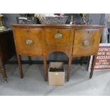 An early 19th century walnut and satinwood strung bow-fronted sideboard, the brass superstructure