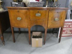 An early 19th century walnut and satinwood strung bow-fronted sideboard, the brass superstructure