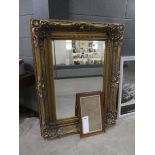 Rectangular bevelled mirror in decorative gilt frame