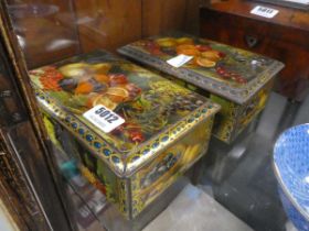 Two fruit decorated vintage tins