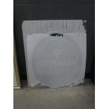 Two perspex Guinness advertising signs