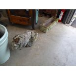 Concrete statue of a lion and a rectangular planter