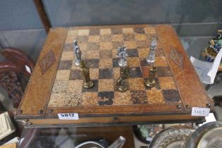 Chess board with metal pieces