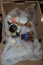 Box with teapot, cups, saucers, and lustreware