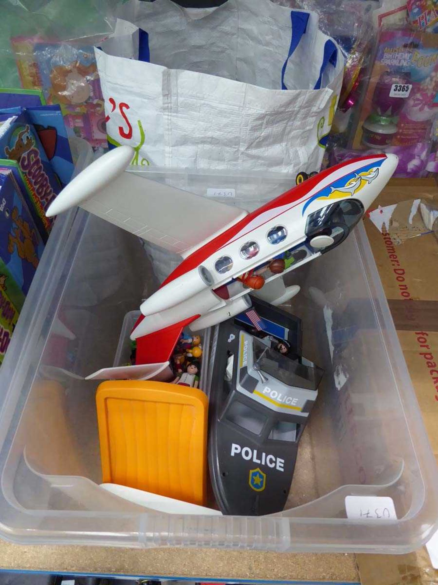 Box of loose Playmobil toys and bag of loose Lego