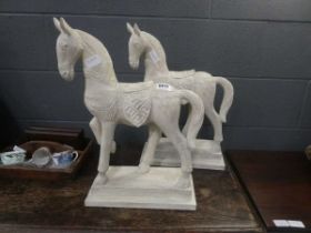 2 wooden carved figures of horses