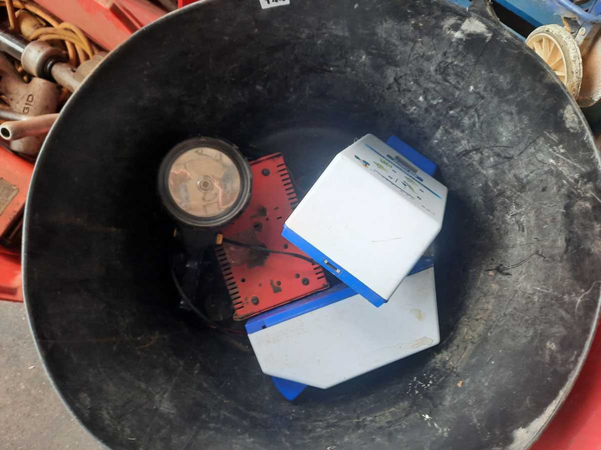 Builders bucket with 2 hand-pumps and a battery charger