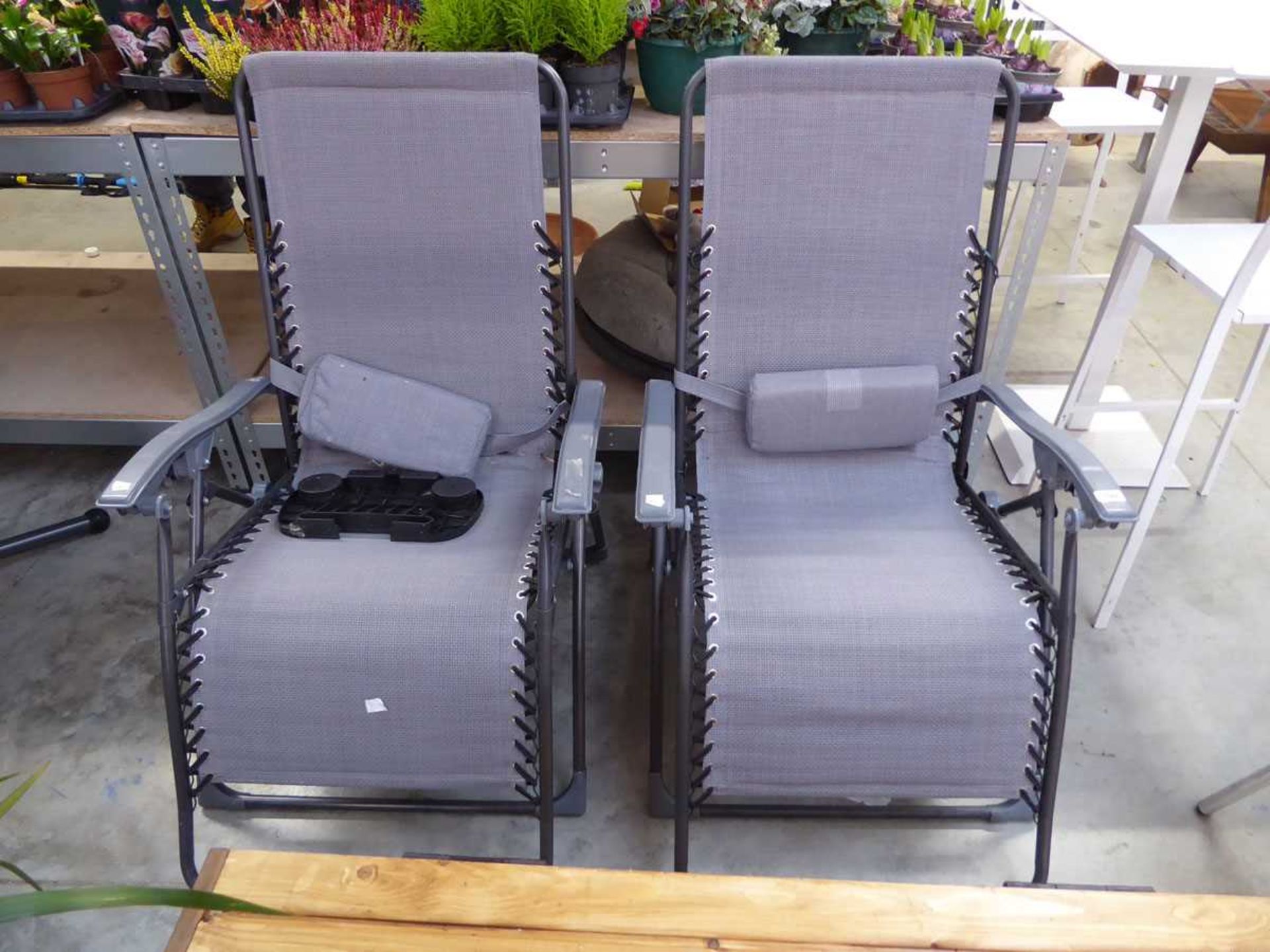 Pair of grey and black mesh sun loungers