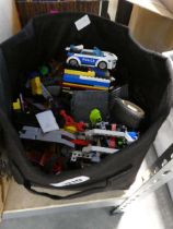 Black bag containing Lego pieces