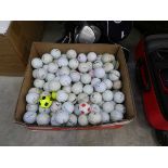 Box containing a large quantity of mixed branded golf balls