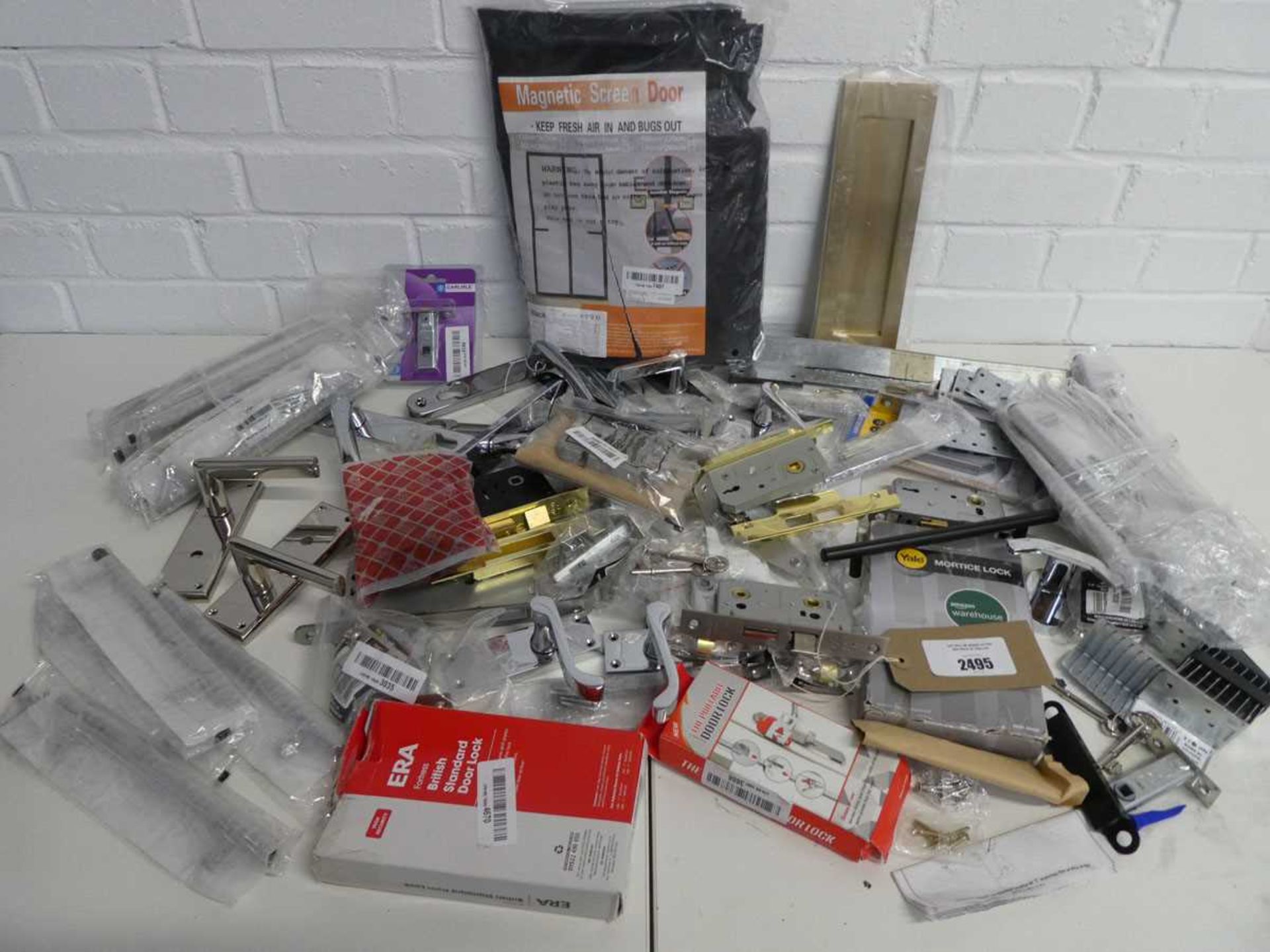 +VAT Bag containing a large quantity of various door handles in mixed colours and sizes, various
