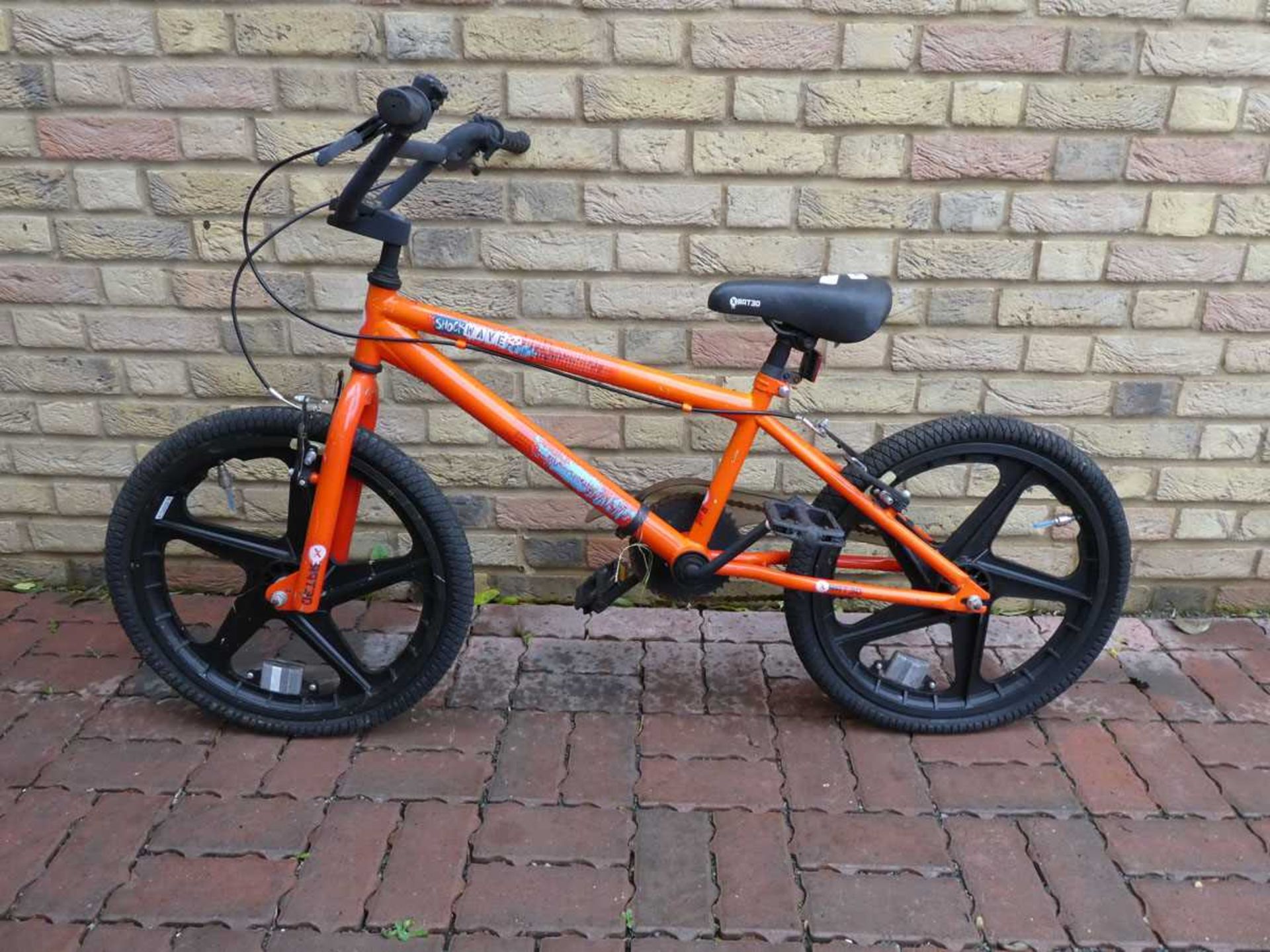 Shockwaves orange BMX bike