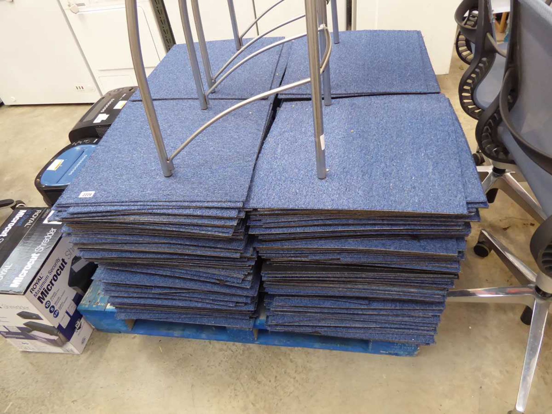 Pallet containing a large quantity of blue coloured carpet tiles