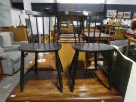 Pair of black painted stick back dining chairs