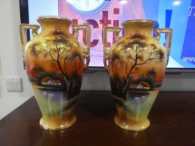 Pair of Noritake Japanese vases depicting waterside cottage 2 significant chips to base of one vase