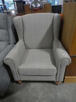 +VAT Wing backed easy chair on beech legs upholstered in a grey checked fabric