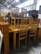 Modern honey oak extending dining table with 4 matching black upholstered dining chairs