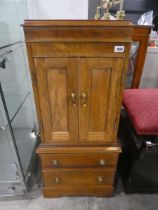 Small wooden media cabinet with 2 drawers to base