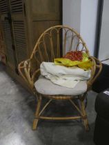 Decorative bamboo easy chair with natural coloured cushion