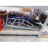 Pair of metal car ramps together with a jack and 2 extendable scrappers
