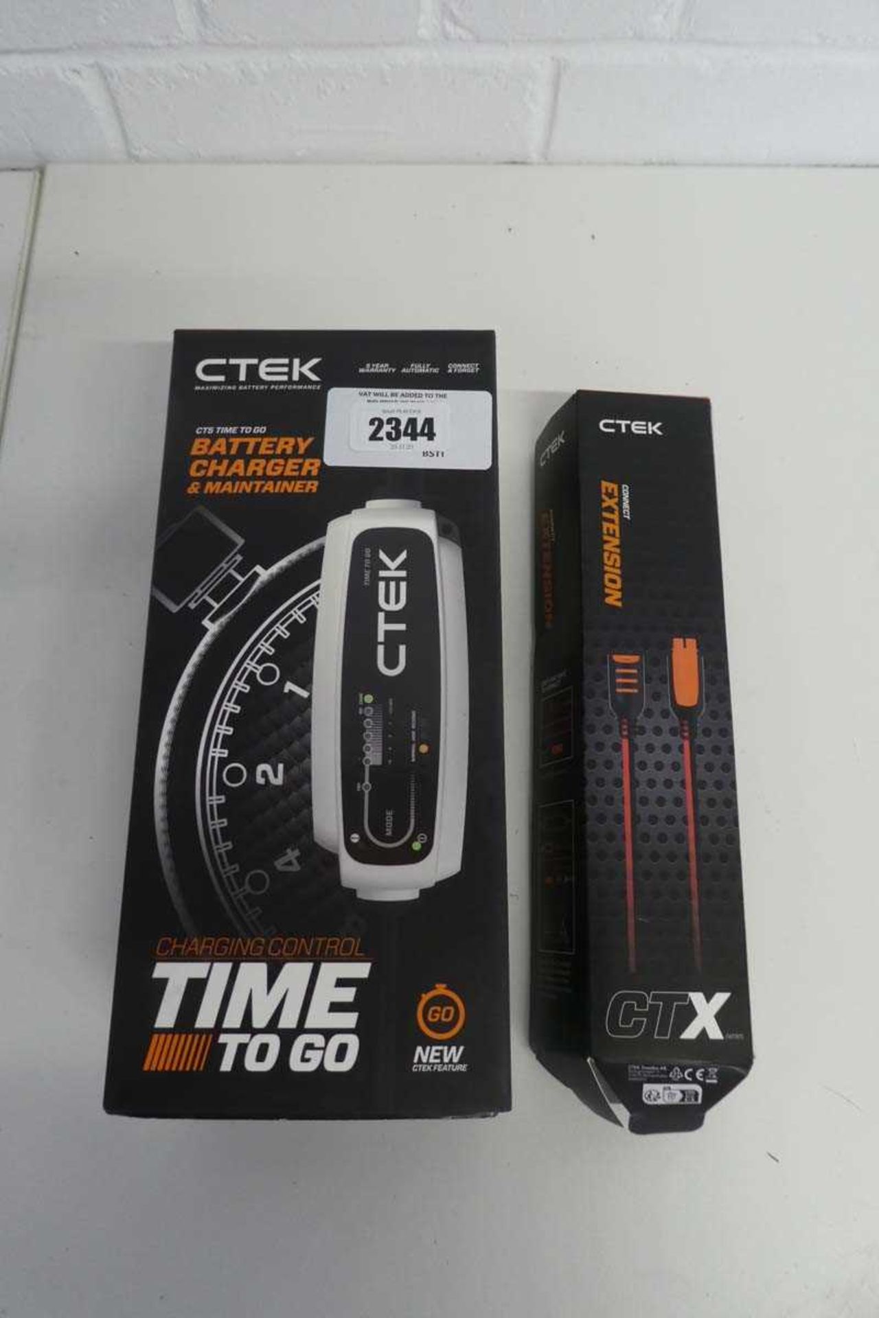 +VAT Boxed CTEK battery charger and maintainer, together with a CTEK extension