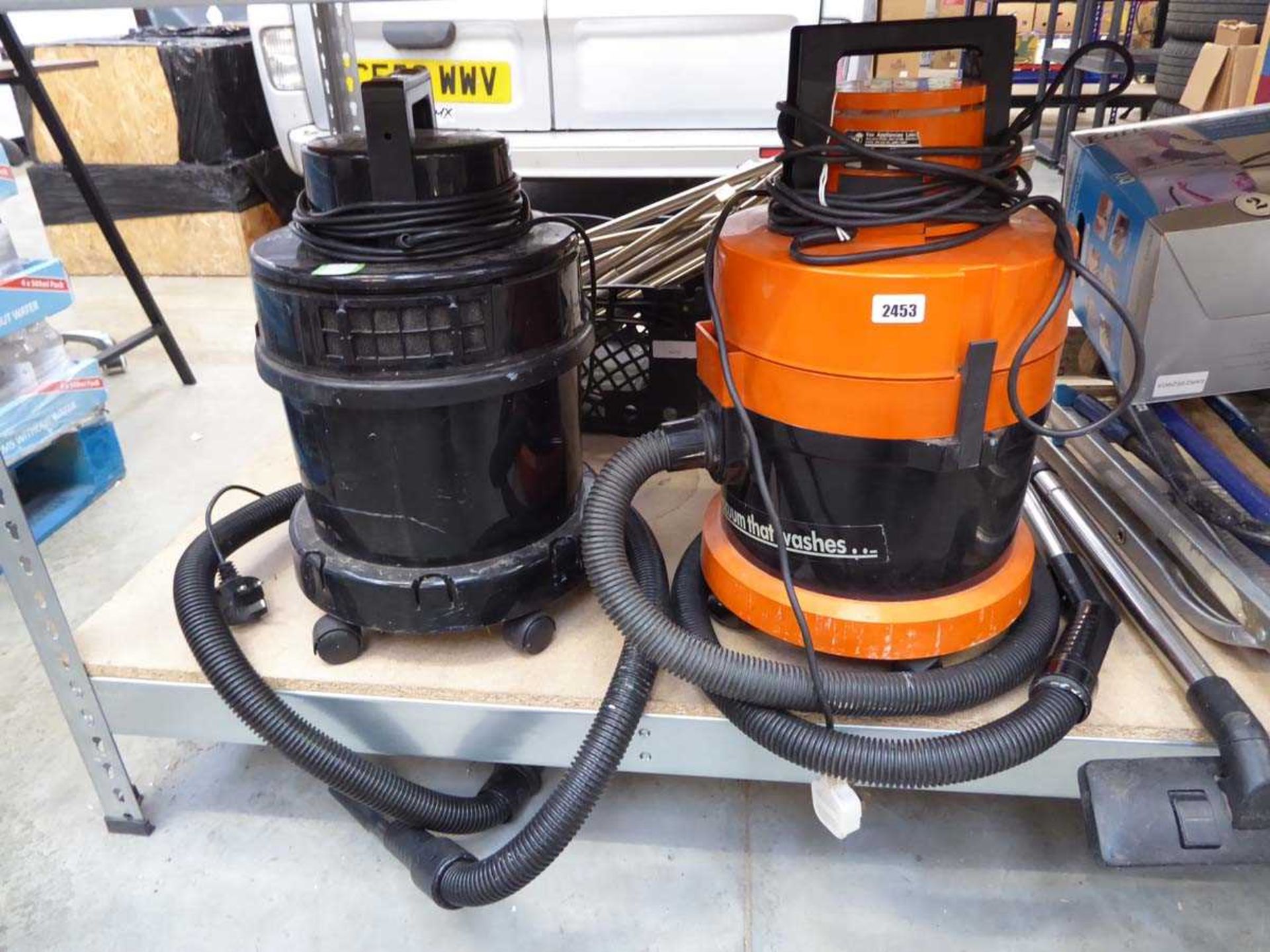 2 Vax wet and dry vacuum cleaners (both with hose, 1 pole)