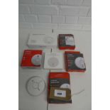 +VAT 4 boxed and 1 unboxed fire angle optical smoke alarms together with a smoke alarm and a photo