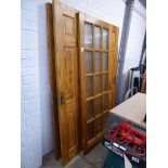 Set of 4 wooden heavy duty doors with fixings together with a 15 glass paneled door with fixings