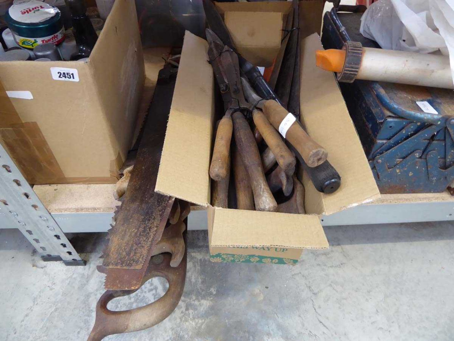 Quantity of vintage wooden handled saws and shears