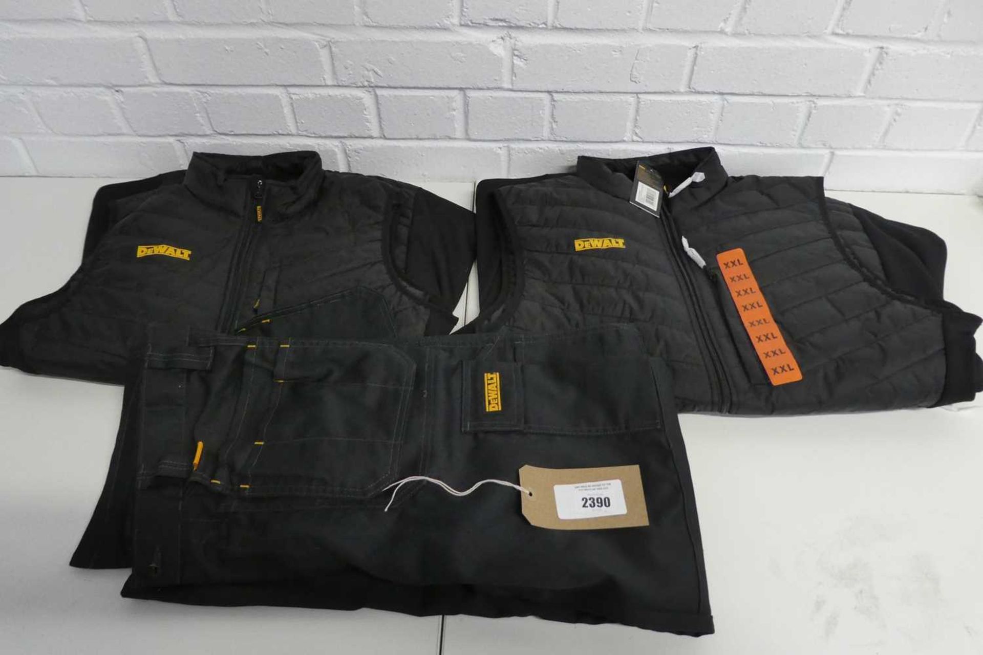 +VAT 2 DeWalt zip up gilets in black, size XXL & M together with a pair of DeWalt multi pocket