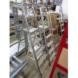 5 various sized aluminum step ladders